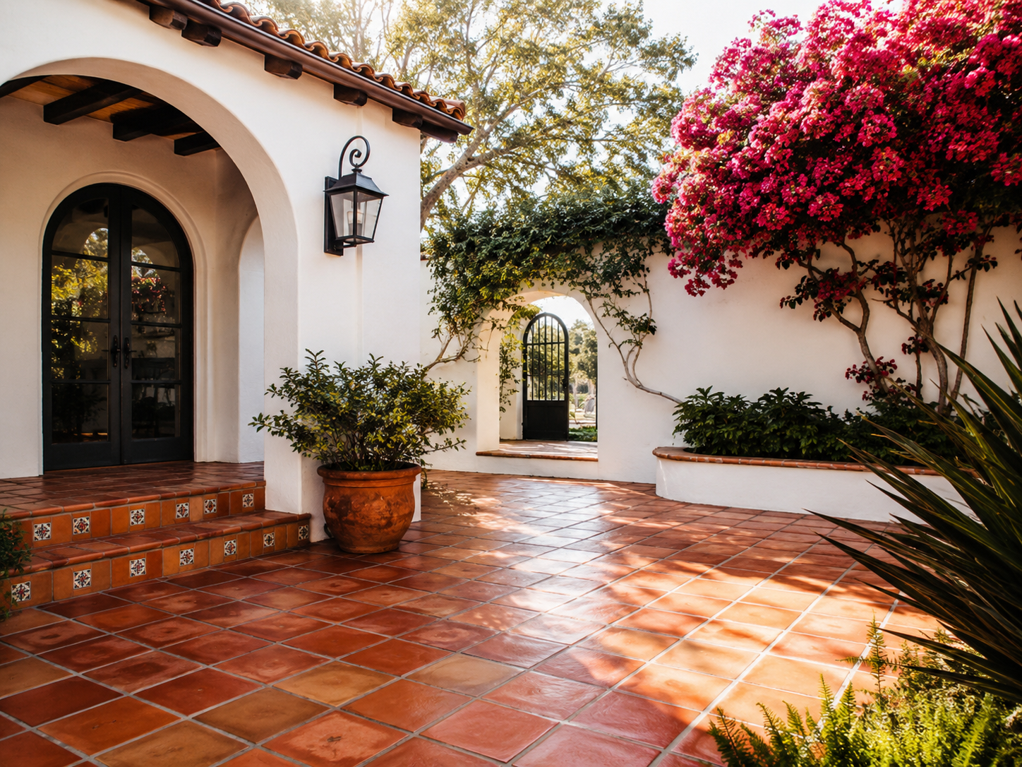 Spanish colonial estate courtyard in Santa Barbara, clean saltillo tile and bougainvillea